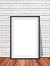 Blank frame in white brick wall with wooden floor texture interior room background, Mockup template for your content or design Royalty Free Stock Photo