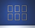 Blank Frames On Blue Wall Royalty Free Stock Photo