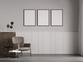 blank frames mock up in modern living room interior with stylish armchair, gray empty wall, scandinavian style, 3d rendering Royalty Free Stock Photo