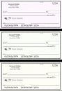 Blank generic bank checks, three of them in different colors are isolated on the background Royalty Free Stock Photo