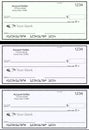 Blank generic bank checks, three of them in different colors are isolated on the background Royalty Free Stock Photo