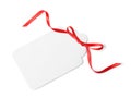 Blank gift tag with satin ribbon on white background Royalty Free Stock Photo