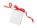 Blank gift tag with satin ribbon on white background Royalty Free Stock Photo