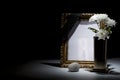 blank gilded mourning frame with bronze vase, chrysanthemum, stone and black tape Royalty Free Stock Photo