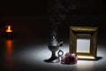 Blank gilded picture frame with thurible and candle flame and ca Royalty Free Stock Photo