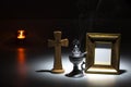 blank gilded picture frame with thurible and candle flame, crucifix Royalty Free Stock Photo