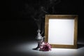 Blank gilded picture frame with thurible and carnation Royalty Free Stock Photo