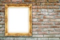 Blank golden frame on brick stone wall Royalty Free Stock Photo