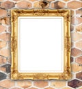 Blank golden frame on brick stone wall Royalty Free Stock Photo