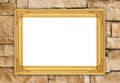Blank golden frame on brick stone wall Royalty Free Stock Photo