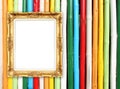 Blank golden frame on colorful bamboo wall