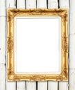 Blank golden frame on colorful bamboo wall