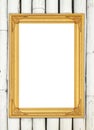 Blank golden frame on colorful bamboo wall