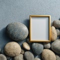 Blank Golden Frame with Natural River Stones on Grey Background Royalty Free Stock Photo