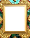 Blank golden frame on Thai style buddha wall