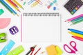 Blank graphing paper notebook with school supplies frame against white with copy space. Back to school. Royalty Free Stock Photo