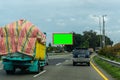 Blank green screen billboard at the highway. Copy space signboard or outdoor billboards on freeway, Royalty Free Stock Photo