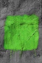 Blank green square with peeling paint on gray plastered wall background. Grunge texture. copy space