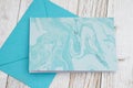 Blank greeting card with blue envelope on wood Royalty Free Stock Photo