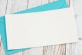 Blank greeting card with blue envelope on wood Royalty Free Stock Photo