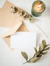 blank greeting card  invitation mockup with craft paper envelope  feminine still life composition Royalty Free Stock Photo