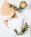 blank greeting card  invitation mockup with craft paper envelope  feminine still life composition Royalty Free Stock Photo