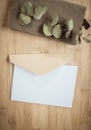 blank greeting card  invitation mockup with craft paper envelope  feminine still life composition Royalty Free Stock Photo