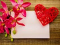 blank greetings with Valentine's day, women's day, on wooden background with red heart and flowers