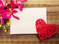 Blank greetings with Valentine`s day, women`s day, on wooden background with red heart and flowers