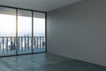 Blank grey mock up wall in modern office hall with concrete floor, big window and city view Royalty Free Stock Photo