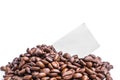 Blank grey post-it paper on pile of roasted coffee beans Royalty Free Stock Photo