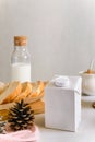 Blank half liter milk box tetra pack  with lid on a table with breakfast. package template, mockup of a retail container for Royalty Free Stock Photo