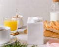 Blank half liter milk box tetra pack  with lid on a table with breakfast. package template, mockup of a retail container for Royalty Free Stock Photo