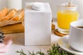 Blank half liter milk box tetra pack  with lid on a table with breakfast. package template, mockup of a retail container for Royalty Free Stock Photo