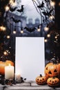 Blank Halloween card or invitation. Halloween vertical background with pumpkins, candles and blank paper sheet with space for your