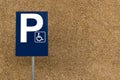 Blank handicapped parking street sign on post with rocky background and lots of copy space Royalty Free Stock Photo