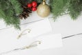 2 blank hang tag mockup with classic christmas border on white wood table