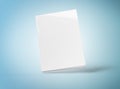 Blank hardcover book mockup floating on blue 3D rendering Royalty Free Stock Photo