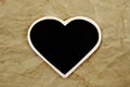 Blank heart-shaped frame on an old paper background Royalty Free Stock Photo