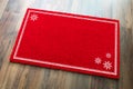 Blank Holiday Red Welcome Mat With Snow Flakes On Wood Floor Background Royalty Free Stock Photo