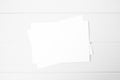 Blank horizontal card mockup with white envelope in white wood background.