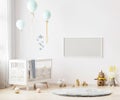 Blank horizontal frame mock up on white wall in nursery room interior background with baby bedding, soft toys, balloons, 3d Royalty Free Stock Photo