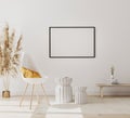 Blank horizontal picture frame mock up in modern interior background with empty white wall, chair and pampas grass, luxury living Royalty Free Stock Photo