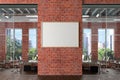 Blank horizontal poster mock up on the red brick wall in office interior. Royalty Free Stock Photo