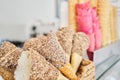 blank ice cream wafers. Waffle cones in an ice-cream shop, Italy. A variety of sugar-free vegan ice cream with natural Royalty Free Stock Photo