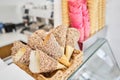 blank ice cream wafers. Waffle cones in an ice-cream shop, Italy. A variety of sugar-free vegan ice cream with natural Royalty Free Stock Photo