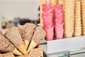 blank ice cream wafers. Waffle cones in an ice-cream shop, Italy. A variety of sugar-free vegan ice cream with natural Royalty Free Stock Photo