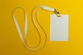 Blank identification card with white neckband isolated on yellow background, space for text