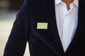 Blank identity tag hanging from a business man suit Royalty Free Stock Photo