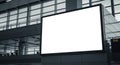 Blank illuminated billboard in modern airport terminal with large windows Royalty Free Stock Photo